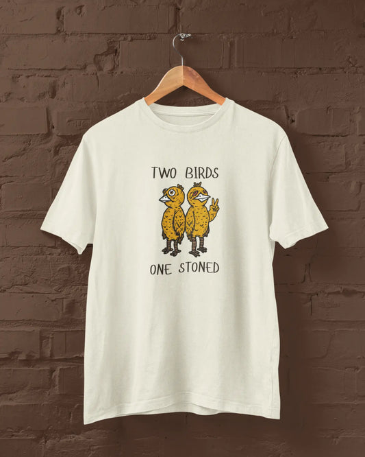 Off White t-shirt with 'Two Birds One Stoned' graphic on a wooden hanger against a brick wall.