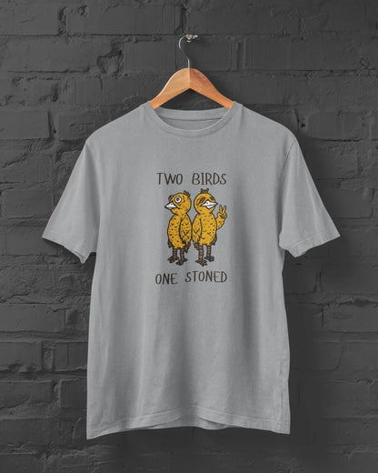 Gray t-shirt with 'Two Birds One Stoned' graphic on a brick wall background