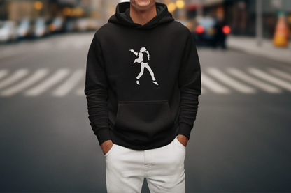 Person wearing a black michael jackson hoodie with a white graphic on a city street